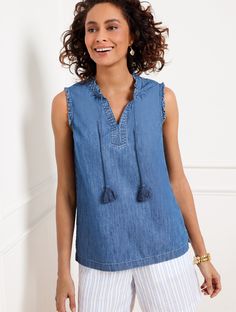 Pretty ruffles at the neckline and shoulders add charm to this ultra-versatile shell. Detailed with tassel ties and side slits at the hem. Crafted from vertically striated denim. Features Sleeveless Hits At Hip Split Neck Pullover Straight hem Imported Fit: Misses: 27"; Petite: 25 1/2"; Plus: 30"; Plus Petite: 28" Material: 100% Cotton Care: Machine Wash Cold; Only Non-Chlorine Bleach When Needed; Turn Garment Inside Out; Tumble Dry Low; Warm Iron, If Needed | Denim Ruffle Trim Shell Sweater - 1 Clothing Details, Classic Style Women, Ruffle Trim, Modern Classic, Sweater Outfits, Ruffles, Inside Out, Shells, Summer Fashion