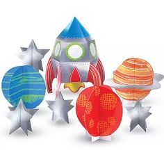 an assortment of paper crafting kits including rockets, planets and stars