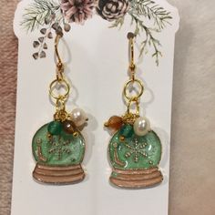 Christmas Holiday Snowglobe Freshwater Pearl And Glass Charm Pierced Fashion Earrings With Gold Toned Metal Alloy Findings And Silicone Safety Stoppers. Dangle Style Earrings Measure 1.75” Lightweight. Nwt Handcrafted By Artistic Creations Festive Christmas Earrings, Festive Christmas Round Earrings, Festive Round Christmas Earrings, Nickel-free Round Christmas Earrings, Handmade Round Christmas Earrings, Gold Earrings For Winter Holiday, Gold Earrings For Holiday Season, Gold Earrings As Winter Gift, Handmade Jewelry For Holiday Celebration