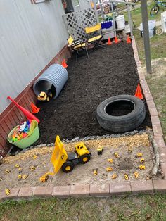 Can’t wait for my grandson to come over to play. Cheap mulch, sandbox sand and rocks. Added some bricks for a border. Got a sun shade to add too. Outdoor Sandbox Ideas, Large Sandbox Ideas, Alternative Sandbox Ideas, Kids Sandbox Ideas, Sand Pit Ideas Play Areas, Sandbox Alternative Ideas, Outdoor Digging Area For Kids, Backyard Sandbox Ideas