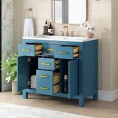 a bathroom vanity with drawers and a mirror