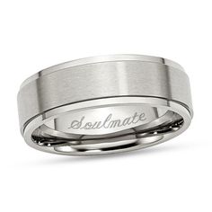 a men's wedding band with the word ultimate engraved on it in white gold