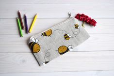 "Bees pencil case, Pencil Pouch, Cosmetic pouch, Make Up Pouch, Charger bag, Project bag, Travel bag, Bridesmaid gift, Bridal purse, Toiletery bag, Bridal clutch You can carry and any other sorts, like cosmetics, pencils or whatever you see fit. *If you want other size or fabric contact me via Etsy conversation length - 3.5\" (9 cm); width - at the zipper top 7\" (17 cm); width - 7,6\" (19,5 cm). Exterior fabric: beige, black, yellow, white* linen 58 %, cotton 42 % (the print placement on the fa Cute Pencil-shaped Cosmetic Bag For Gifts, Cute Pencil Shaped Cosmetic Bag Gift, Cute Pencil-shaped Cosmetic Bag Gift, Handmade Pouch Pencil Case For School, Handmade Pencil Case Pouch For School, Handmade School Pencil Case Pouch, Pencil Case Organizer, Charger Bag, Bird Purse