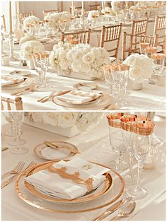 the table is set with white flowers and gold chargers on it, along with place settings