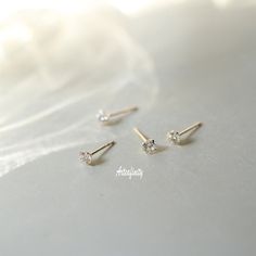 "14k solid Gold Studs, Dainty Earrings, Wedding Earrings, Gift For Her, CZ Earrings, Cute Earrings  -------DETAILS------- - \"Single\" - refers to 1 individual earring     \"Pair\" - refers to 2 earrings - Material: 14K solid gold - Stamped with Au585(14K) hallmark  - AAA Zircon - size: 4*4mm  ear nail length: 10mm width: 0.65mm - Free Beautifully wrapped & boxed -------PACKAGING------- We offer a free gift wrap option upon request. Just leave me a note at checkout saying that you would like your order gift wrapped. Each item is beautifully packaged in a letterbox friendly, hand stamped jewellery box made from 100% recycled card . -------MAINTENANCE------- Please store your accessories in a clean, dry environment. Avoid contact with cosmetics, perfumes, aerosols and moisturisers as they ma Elegant Tiny Cubic Zirconia Earrings, Tiny Cubic Zirconia Jewelry For Anniversary, Delicate Diamond Wedding Jewelry, Tiny Gold Elegant Diamond Earrings, Dainty Hypoallergenic Bridal Earrings For Anniversary, Elegant Gold Diamond Earrings, Wedding Diamond Jewelry, Dainty White Diamond Earrings For Wedding, Dainty Diamond White Diamond Earrings For Wedding