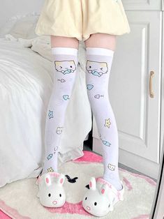 These adorable over knee stocking feature a charming kitty holding a fish design, complemented by additional playful kitty and fishbone patterns. Perfect for adding a touch of whimsy to your outfit, these socks are a must-have for any kawaii fashion enthusiast.   Please note that the price includes one pair of socks. Cute White Thigh High Stockings, Harajuku Style White Thigh High Stockings, White Harajuku Knee-high Socks, White Harajuku Thigh-high Stockings, Cute White Cat Design Socks, Fitted White Harajuku Socks, Playful Fitted White Socks, White Harajuku Thigh-high Socks, Harajuku Style White Knee-high Stockings