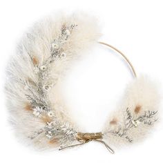 a white wreath with feathers and flowers on it's side, against a white background