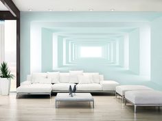 a living room with white furniture and blue walls