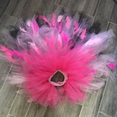 a pink and black headpiece on the floor