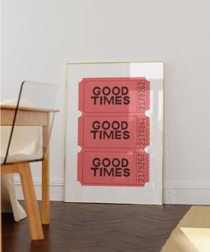 two red tickets sitting on top of a wooden floor next to a white chair and table