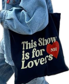 a person carrying a bag with the words, this show is for lovers on it