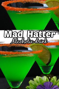 three glasses filled with green liquid and garnished with orange sprinkles