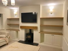 a living room filled with furniture and a flat screen tv mounted on the wall above a fireplace