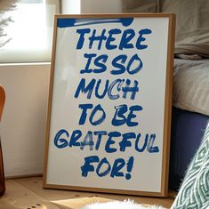 there is so much to be grateful for sign on the floor next to a guitar