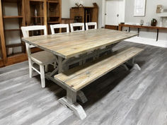 A 7ft farmhouse dining table with a gray and white-wash distressed trestle base, styled with coordinating chairs and bench options in a coastal-inspired dining room. Coastal Kitchen Table, Farmhouse Pedestal Table, Farmhouse Trestle Table, Farmhouse Dining Table Set, Diy Farm Table, Farmhouse Style Dining Table, Turned Table Legs, Trestle Tables, Kitchen Table Set