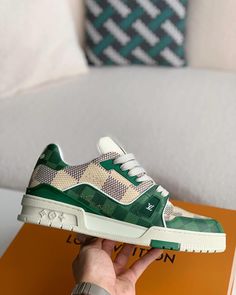 Embrace iconic style with a contemporary twist in these Louis Vuitton Trainer-inspired sneakers. The classic low-top silhouette is reimagined with a vibrant green and white colorway, featuring the signature Damier canvas for a touch of luxury. Crafted with meticulous attention to detail, these sneakers offer a premium look and feel, perfect for those seeking a statement piece that seamlessly blends streetwear edge with high-fashion inspiration. Luxury Designer Sneakers With Logo Print, Luxury Men's Sneakers With Logo Patch, Luxury Custom Sneakers With Contrasting Heel Counter, Designer Luxury Custom Sneakers With Logo Detail, Luxury Custom Sneakers With Logo Print, Luxury Modern Custom Sneakers With Embossed Logo, Luxury Technical Style Streetwear Sneakers, Luxury Classic Sneakers With Logo, Luxury Classic Sneakers With Embossed Logo