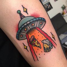 a tattoo with an image of a spaceship and pizza on it's arm that is flying through the air