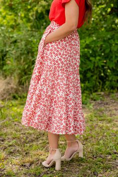 We cannot get over how stylish this skirt is! The beautiful floral print and tiered style fit makes such a cute, elegant look! Wear this skirt to any event and you are sure to receive compliments! We love tucking a blouse into this for a more elevated look or a basic or graphic tee for a casual feel! Self: 100% PolyesterLining: 100% Rayon Hand wash cold. Do not bleach. Lay flat to dry. Low iron if necessary. Kimono Blouse, Tiered Midi Skirt, Romper And Jacket, Guest Attire, Wedding Attire Guest, Long Sleeve Short Dress, Loungewear Sets, Low Iron, Long Sleeve Midi Dress