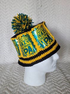 "This a fun and unique item! Be the life of any party with this zany beer can hat. This is made from real Sierra Nevada Hazy Little Thing IPA beer cans, made with yellow and black acrylic yarn. This hat measures 23 1/2 \" on the inside, designed for a man. This hat will stretch some and is also comfortable if it's a little large. Custom orders are welcome! Send us your idea for can, color and size and we can make it happen! NOTE: these are fragile items. Be gentle with the hat or the cans will b Crochet Beer Can Hat, Beer Can Hat, Crochet Beer, Ipa Beer, Beer Cans, Black Acrylic, Sierra Nevada, Black Acrylics, Yellow And Black