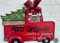 a red truck with a christmas tree on the back and merry moose crafty n'based by africa