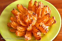 some fried food is on a green plate