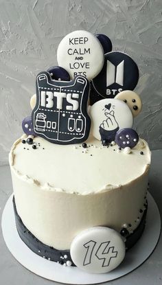 a birthday cake with buttons on it and the words, keep calm i love bts