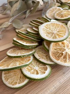 slices of lemon are arranged on a wooden table