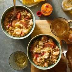 two bowls of soup on a wooden table