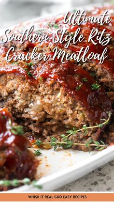 meatloaf on a plate with sauce and herbs