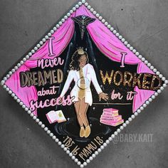 a decorated graduation cap that says i never dreamed about being successful in the world