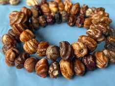 several different types of nuts on a blue surface