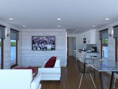 a living room filled with furniture next to a kitchen