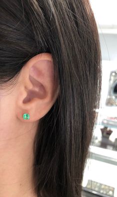 Featured here is a beautiful set of Asscher cut Colombian emerald studs in fine 14K yellow gold. Displayed are vibrant-green emeralds with very good transparency, accented by a simple double-prong yellow gold mount, allowing for the emerald to be shown in full view. Minor flaws such as a carbon spec are seen in one emerald. The earth mined, green Colombian emeralds have a desirable lush green color with excellent qualities. These earrings are ideal for everyday use and are the perfect accessory Tiny Bow, Emerald Earrings Studs, Claw Prong, Colombian Emeralds, Square Cut, Emerald Earrings, Cluster Earrings, Emerald Jewelry, Natural Emerald