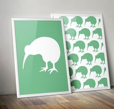 two green and white framed pictures with kiwi silhouettes on them, one in front of the other