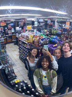 a group of people taking a selfie in a store's fish eye lens