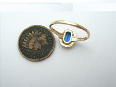 Fine Jewelry - This is a vintage 10K yellow gold ring with a lab created blue sapphire gemstone. It is hallmarked 10K, signed PSCO for Plainville Stock Co, is a size 6.25, stone setting measures 10mm by 8.5mm and weight is 1.25 grams. Vintage Blue Sapphire Ring With Bezel Setting, Vintage Blue Ring With Bezel Setting, Blue Opal Ring In 14k Gold For Formal Occasions, Vintage 14k Gold Sapphire Ring With Bezel Setting, Vintage Sapphire Ring With Bezel Setting In 14k Gold, Vintage Blue Sapphire Ring Stamped 14k, Vintage Blue Topaz Ring In 14k Gold, Victorian 14k Stamped Blue Rings, Vintage Blue Opal Ring For Gift