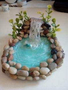 a fountain made out of rocks and water