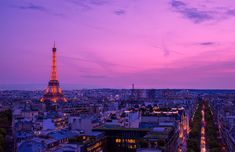 the eiffel tower is lit up at night in paris, france as seen from above