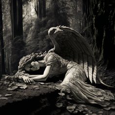 black and white photograph of an angel in the woods