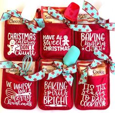 six red oven mitts with christmas sayings and baking utensils in them