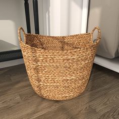 a basket sitting on the floor next to a door