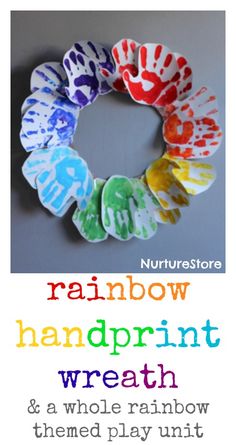 the rainbow handprint wreath is made from paper and painted with different colors on it