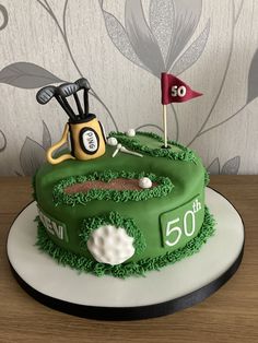 a birthday cake for a man who is celebrating his 50th birthday with golf gear