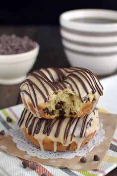 two chocolate chip donuts sitting on top of each other