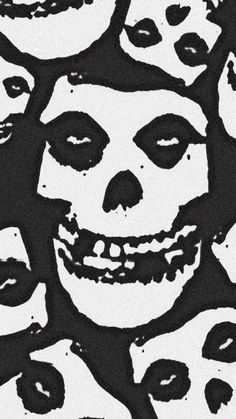 a black and white drawing of a skull with many faces