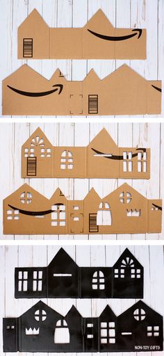 cardboard houses are cut out to look like they have been made into an amazon logo