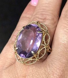 VINTAGE AMETHYST 14K YELLOW GOLD FILIGREE RING Unique and rare design, Fine Oval Amethyst Solitaire Ring approximately 15ct, set in a gorgeous filagree design band. There is a scratch/crack in back of stone. (see pics) Does not go through. It is not really visible from front, I've worn and never noticed until photographing now. Price reflects this. This item is vintage and beautiful that is sure to be one of your favorite pieces! Oval cut Amethyst totaling approximately 15 CTW! Measures approxim Filagree Design, Black Opal Pendant, Filigree Ring Gold, Puffed Heart, Black Gift Boxes, Gold Filigree, Filigree Ring, Ring Unique, Opal Pendants