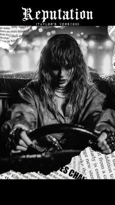 a woman sitting at the wheel of a car with her hands on the steering wheel