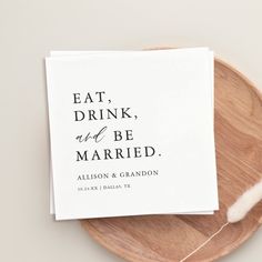 a card with the words eat drink and be married on it sitting on a plate