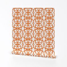 an orange and white square with circles on it, against a white wallpaper background